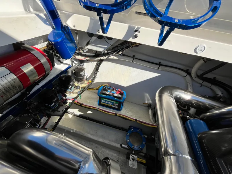 Slide: The Image of Engine compartment of 2007 Fountain 35 Lightning boat with battery and exhaust. - 11