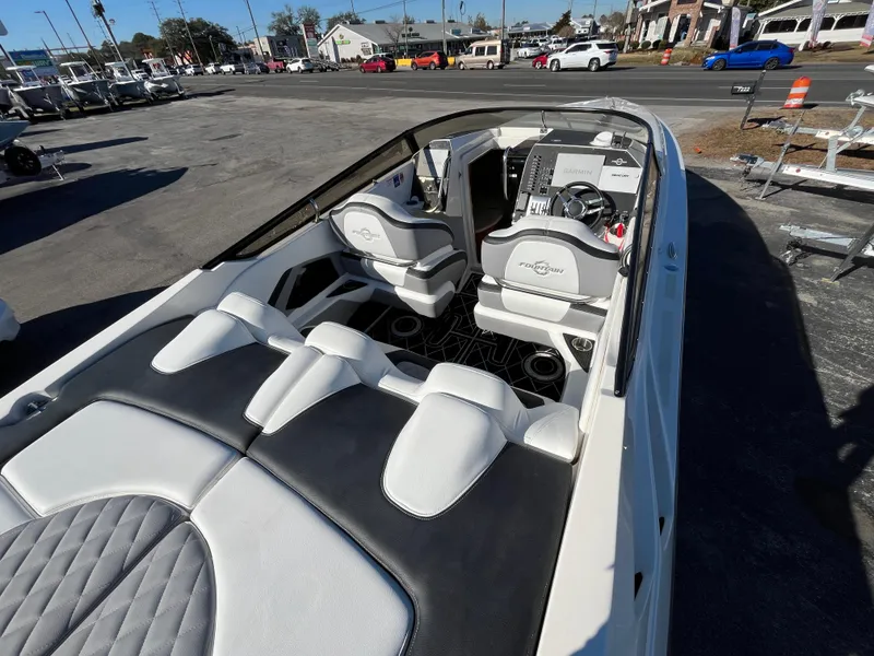 Slide: The Image of Interior of a 2007 Fountain 35 Lightning boat, featuring modern seats and console. - 12