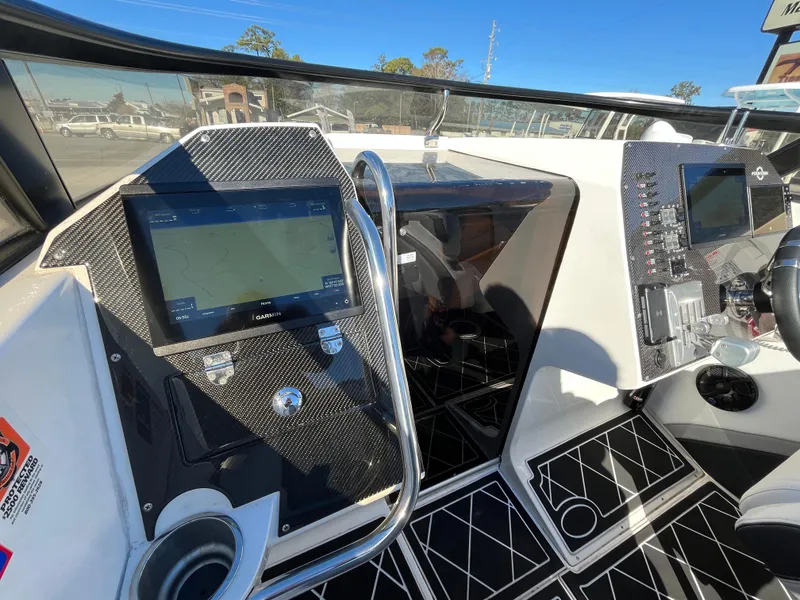 Slide: The Image of Interior of a 2007 Fountain 35 Lightning boat with modern controls. - 15