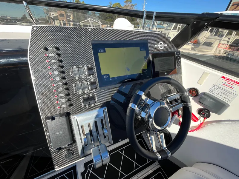 Slide: The Image of Dashboard of a 2007 Fountain 35 Lightning boat with navigation system. - 16