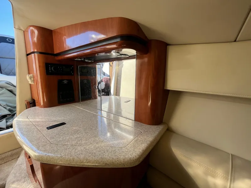 Slide: The Image of Interior of a 2007 Fountain 35 Lightning yacht with wood and leather accents. - 21