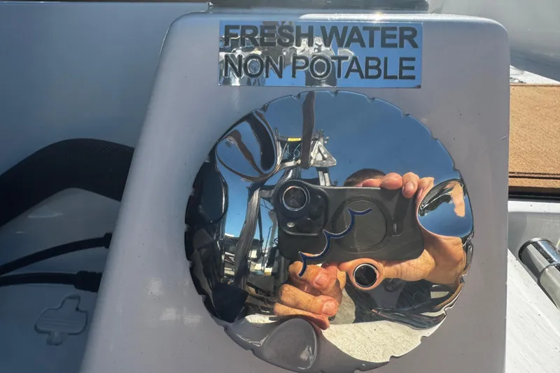 Slide: The Image of Close-up of a 2026 Sea Pro 245FLX Sandbar's non-potable freshwater cap. - 11