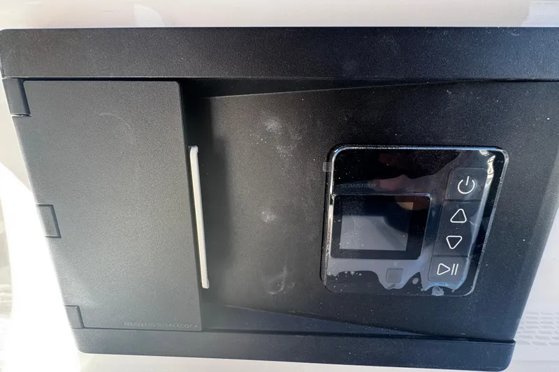 Slide: The Image of Control panel on 2026 Sea Pro 245FLX Sandbar boat, featuring digital display and buttons. - 21