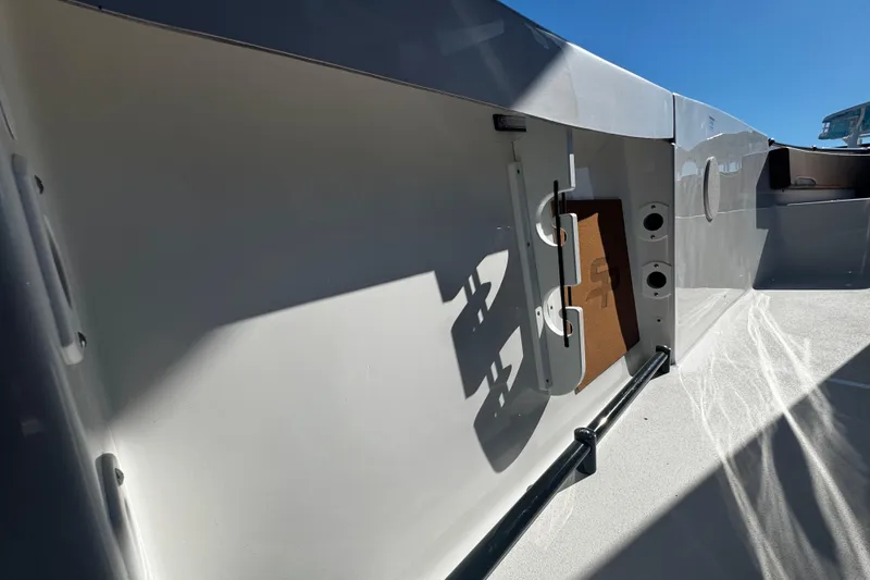 Slide: The Image of 2026 Sea Pro 245FLX Sandbar boat interior with sleek design and storage features. - 26