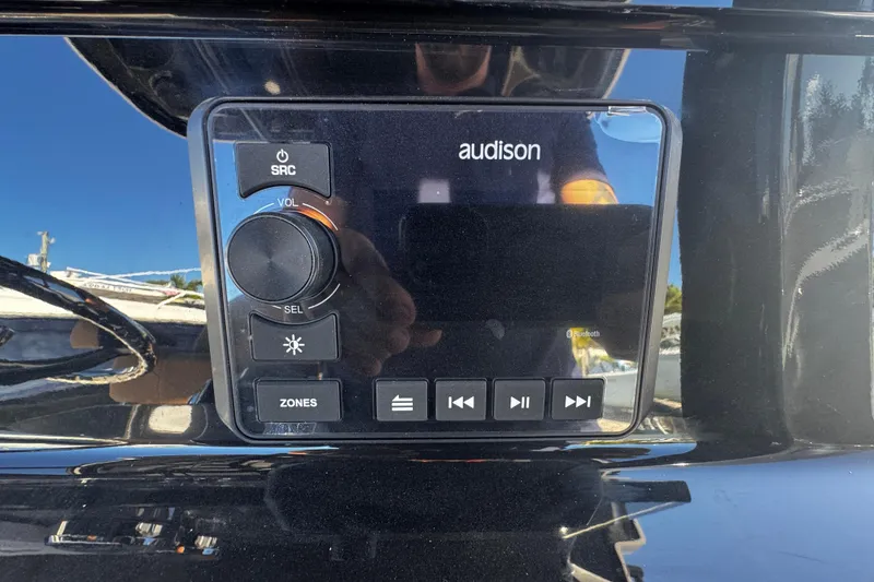 Slide: The Image of Audio control panel on 2026 Sea Pro 245FLX Sandbar boat dashboard. - 28