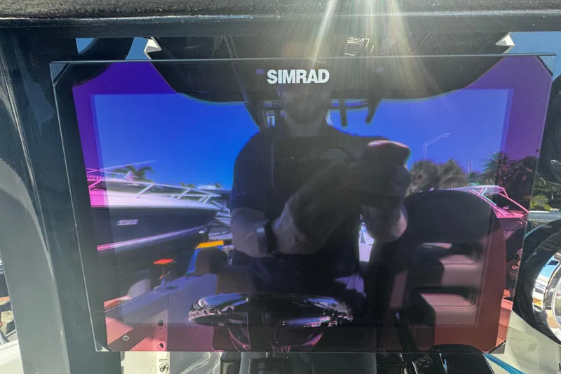 Slide: The Image of Simrad display on 2026 Sea Pro 245FLX Sandbar boat, reflecting surroundings. - 31
