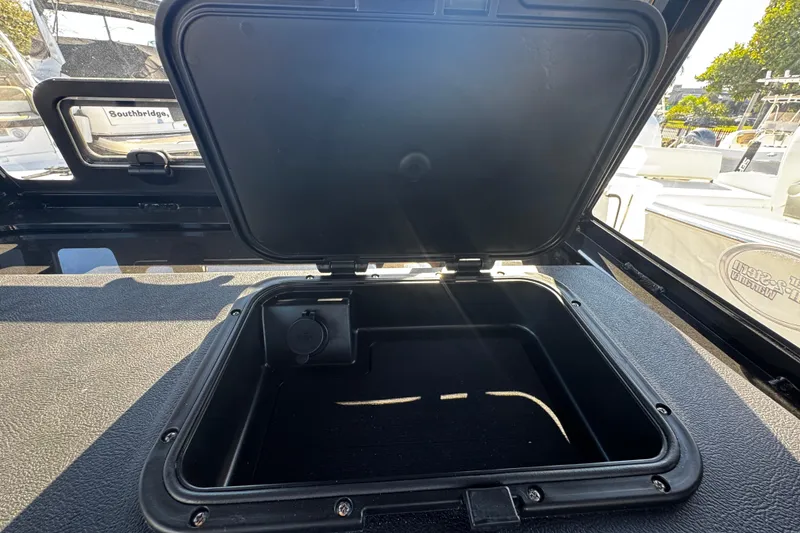 Slide: The Image of Open storage compartment on 2026 Sea Pro 245FLX Sandbar boat, showcasing interior space. - 36