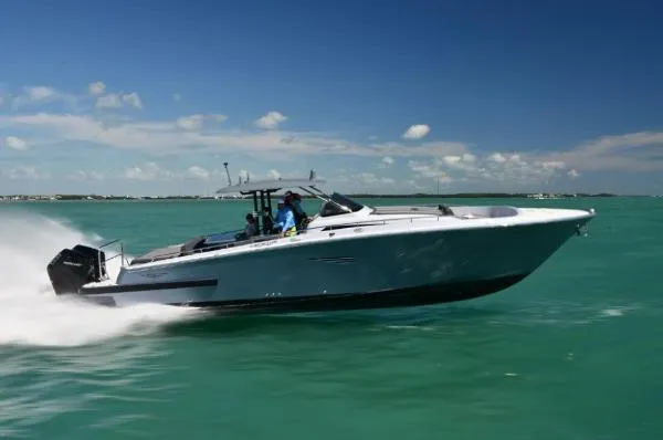 The Image of 2023 Canados 435 GLADIATOR cruising on turquoise waters under a clear blue sky. - 0