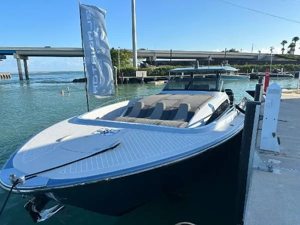 Slide: The Image of 2023 Canados 435 GLADIATOR yacht docked by a marina under clear blue skies. - 3