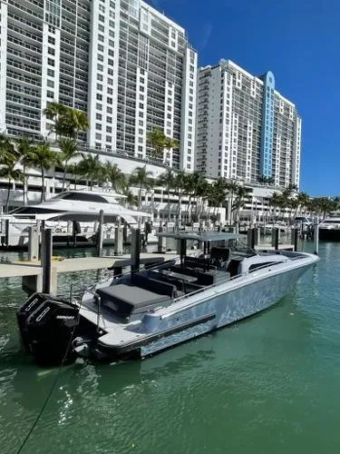 Slide: The Image of 2023 Canados 435 GLADIATOR yacht docked near luxury waterfront buildings. - 4