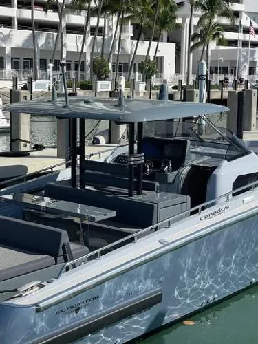 Slide: The Image of 2023 Canados 435 GLADIATOR yacht docked at marina with modern design and sleek features. - 5