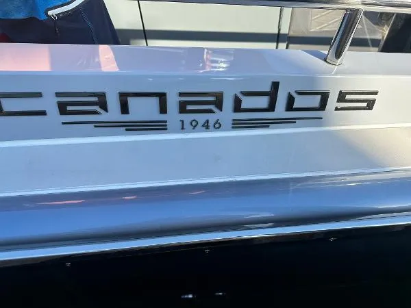 Slide: The Image of 2023 Canados 435 Gladiator boat with logo and "1946" inscription on the side. - 9