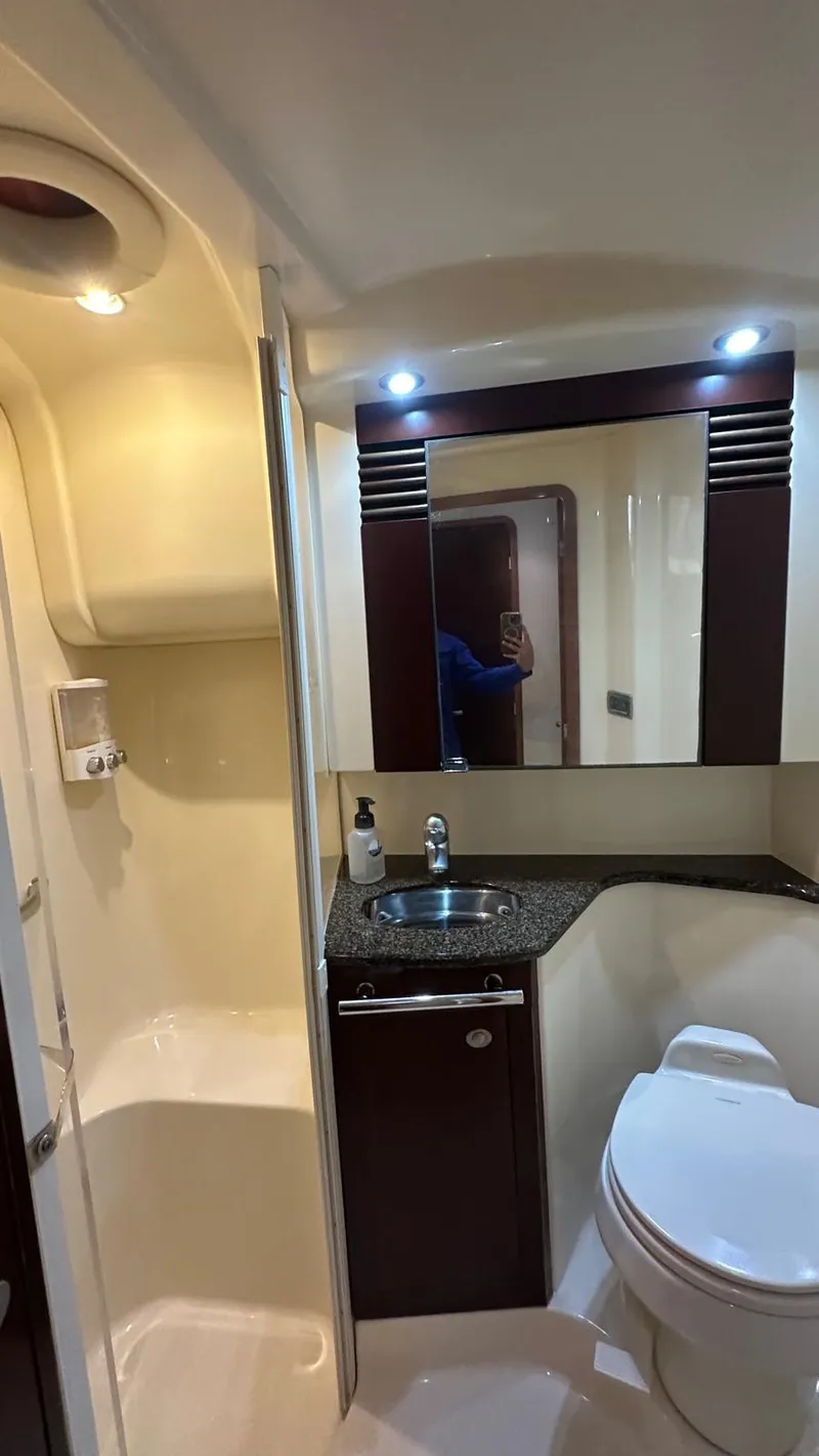 Slide: The Image of Luxurious bathroom in 2006 Sea Ray 44 Sedan Bridge yacht with modern fixtures. - 18