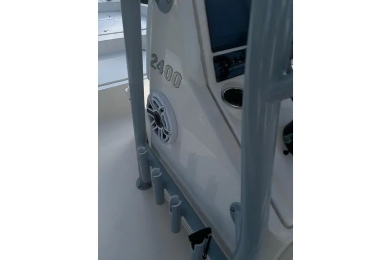 Slide: The Image of 2022 Pathfinder 2400 TRS boat interior with rod holders and speaker. - 27