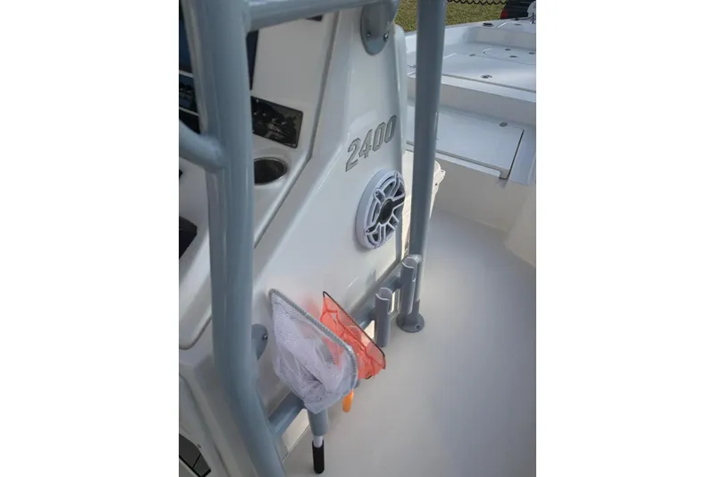 Slide: The Image of 2022 Pathfinder 2400 TRS boat interior with speaker and fishing net. - 28