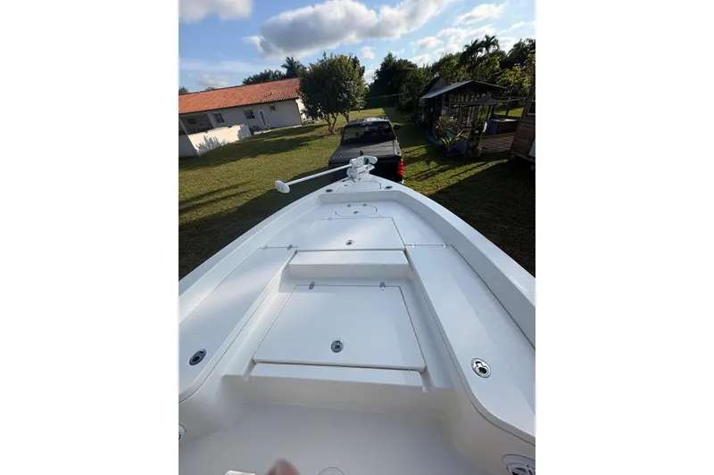 Slide: The Image of 2022 Pathfinder 2400 TRS boat on trailer in a sunny backyard setting. - 30