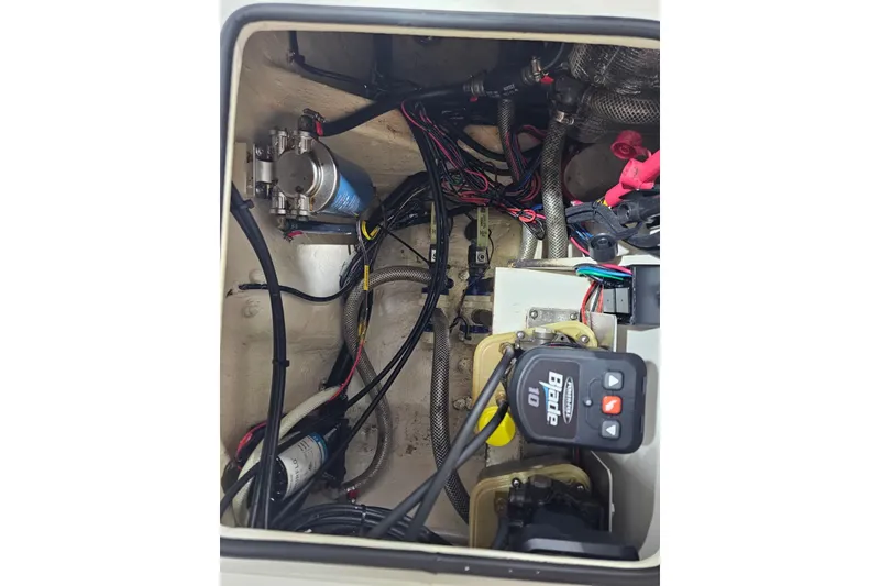 Slide: The Image of Engine compartment of a 2022 Pathfinder 2400 TRS boat, showcasing wiring and components. - 35