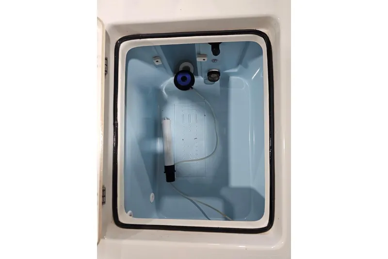 Slide: The Image of Livewell compartment of a 2022 Pathfinder 2400 TRS boat, featuring a clean interior. - 37