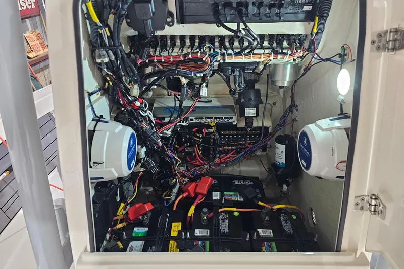 Slide: The Image of Electrical system inside a 2022 Pathfinder 2400 TRS boat, showcasing wiring and components. - 39