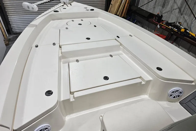 Slide: The Image of 2022 Pathfinder 2400 TRS boat deck with storage compartments and speakers. - 40