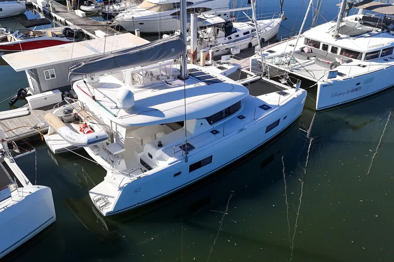 Slide: The Image of 2017 Lagoon 42 catamaran docked at marina, aerial view. - 83