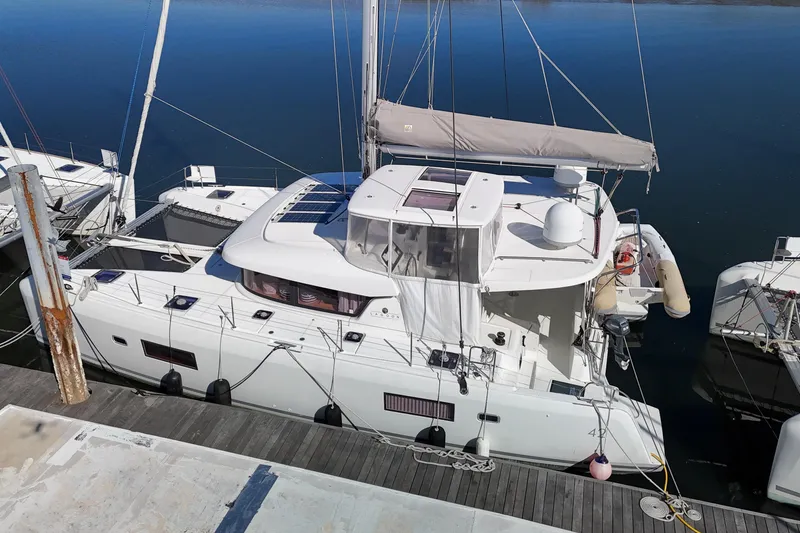 Slide: The Image of 2017 Lagoon 42 catamaran docked at marina, viewed from above. - 88