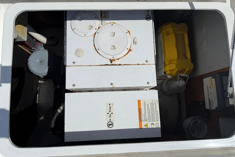 Slide: The Image of Engine compartment of a 2017 Lagoon 42 catamaran with equipment and storage. - 99