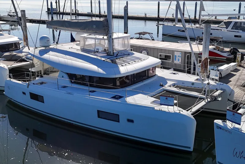 The Image of 2017 Lagoon 42 catamaran docked at marina, showcasing sleek design and modern features. - 0