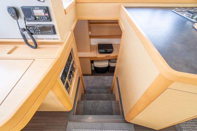 Slide: The Image of Interior of 2017 Lagoon 42 yacht showing stairs and navigation equipment. - 29