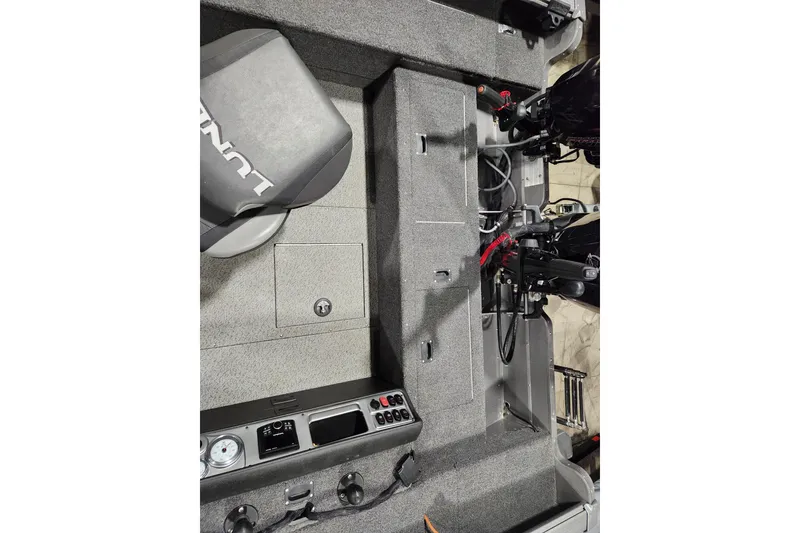Slide: The Image of 2024 Lund 1875 Pro Guide boat interior with seating and control panel. - 8