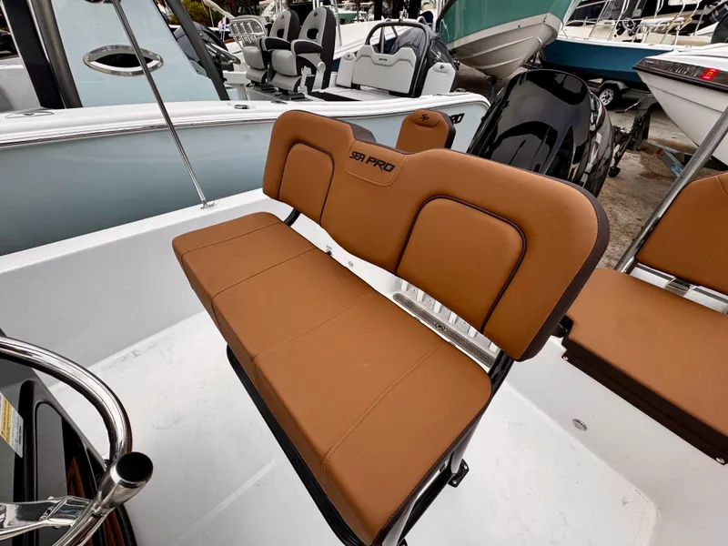 Slide: The Image of 2025 Sea Pro 202 Center Console boat with tan seating, showcasing sleek design and comfort. - 13