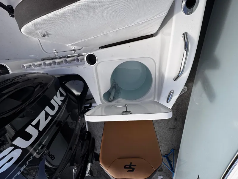 Slide: The Image of 2025 Sea Pro 202 Center Console boat interior with Suzuki engine and seating. - 15