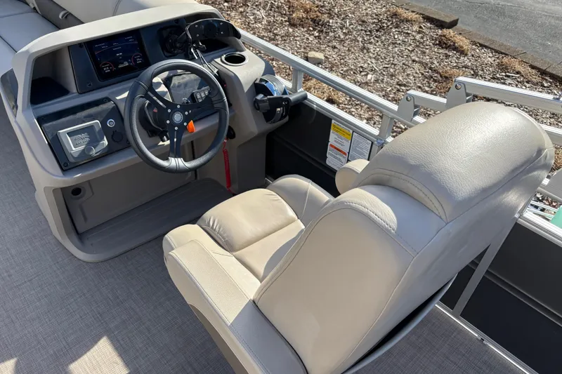 Slide: The Image of 2024 Sun Tracker Party Barge 20 DLX helm with steering wheel and captain's chair. - 11