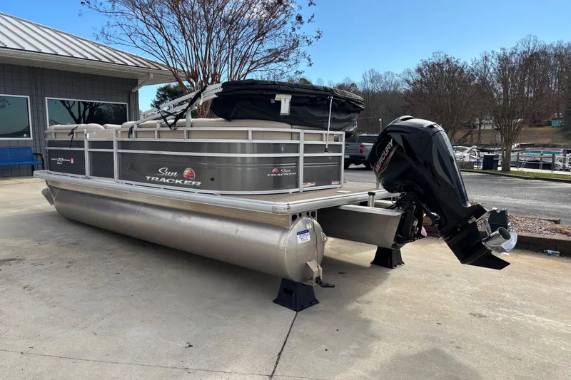 Slide: The Image of 2024 Sun Tracker Party Barge 20 DLX pontoon boat with Mercury outboard motor. - 4