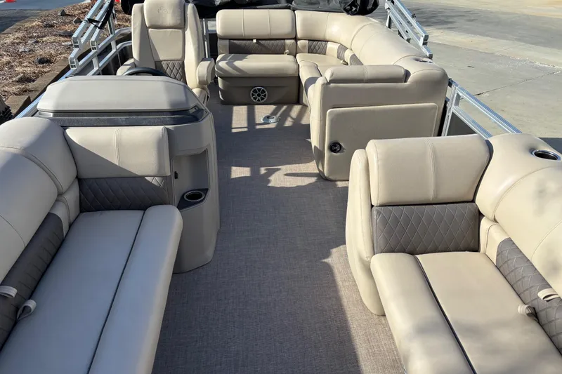Slide: The Image of 2024 Sun Tracker Party Barge 20 DLX interior with plush seating and modern design. - 9