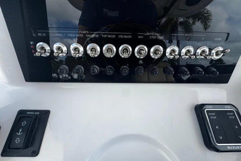Slide: The Image of Control panel of 2026 Sea Pro 262 Offshore boat with switches and buttons. - 21