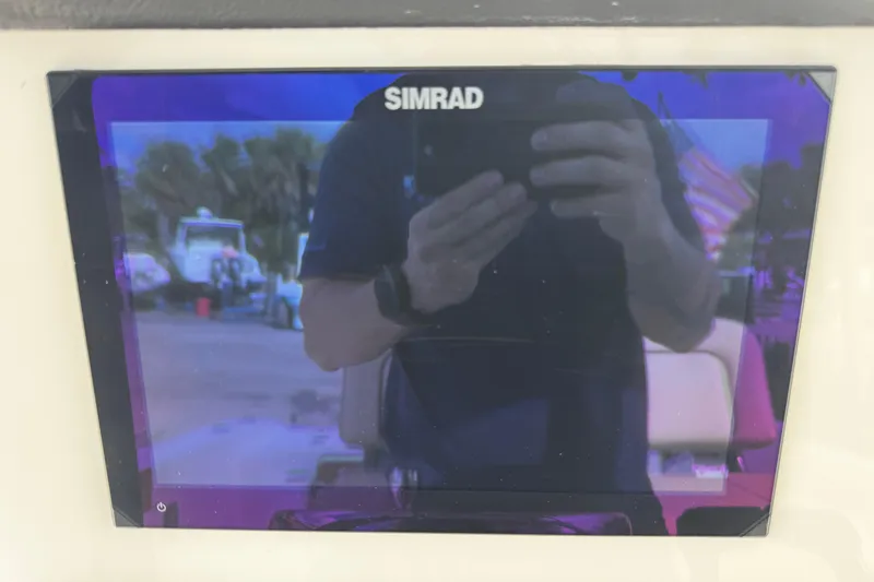 Slide: The Image of Simrad display on 2026 Sea Pro 262 Offshore boat, reflecting surroundings. - 27
