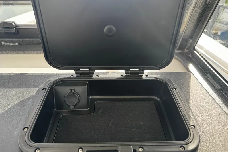 Slide: The Image of Open storage compartment on 2026 Sea Pro 262 Offshore boat. - 29