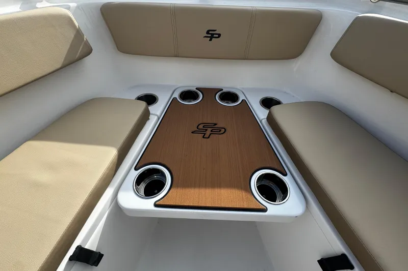 Slide: The Image of 2026 Sea Pro 262 Offshore boat interior with cushioned seating and table. - 37
