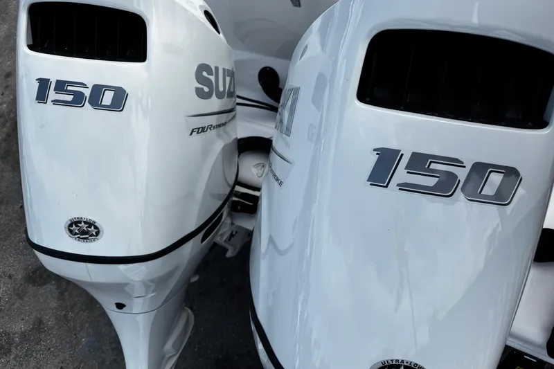 Slide: The Image of Twin Suzuki 150 horsepower outboard engines on a 2026 Sea Pro 262 Offshore boat. - 43