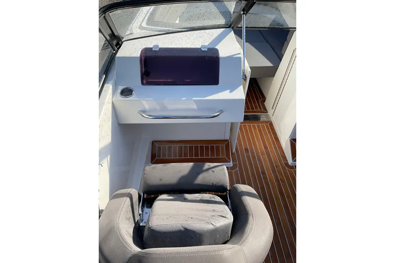 Slide: The Image of Interior view of 2017 Draco 22RS boat with sleek seating and wooden flooring. - 15