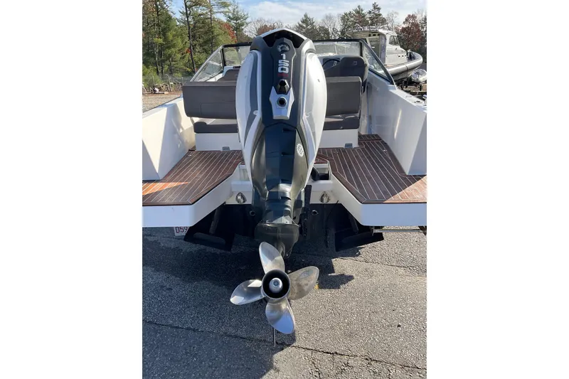 Slide: The Image of 2017 Draco 22RS boat with outboard motor, rear view on a sunny day. - 19
