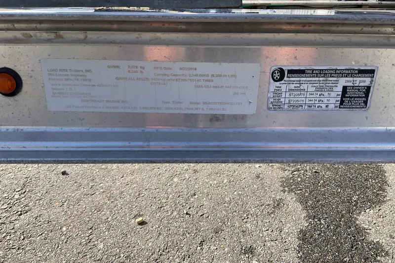 Slide: The Image of Label on Draco 22RS 2017 trailer showing tire and loading information. - 22