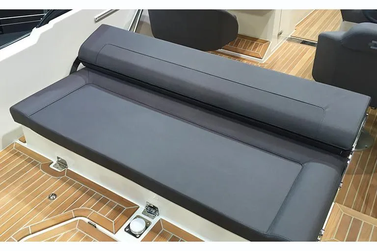 Slide: The Image of Manufacturer Provided Image: Draco 22RS 2018 boat interior with cushioned seating and wooden flooring. - 3