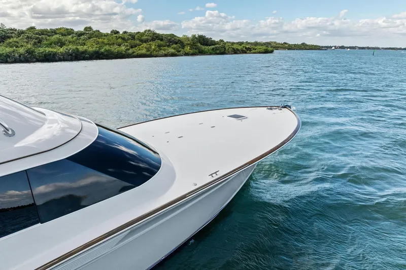 Slide: The Image of 2017 Spencer Convertible yacht cruising on a serene blue lake. - 14