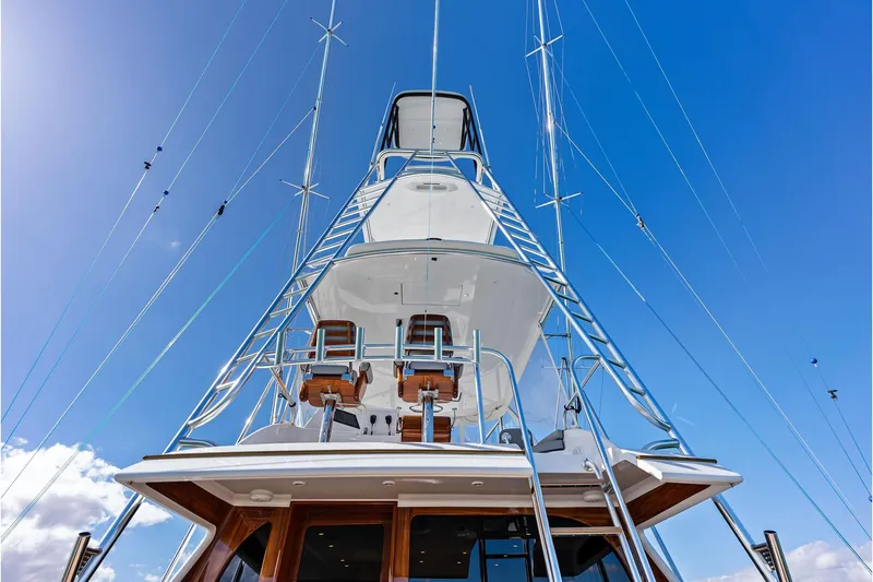 Slide: The Image of 2017 Spencer Convertible yacht with tower against clear blue sky. - 18