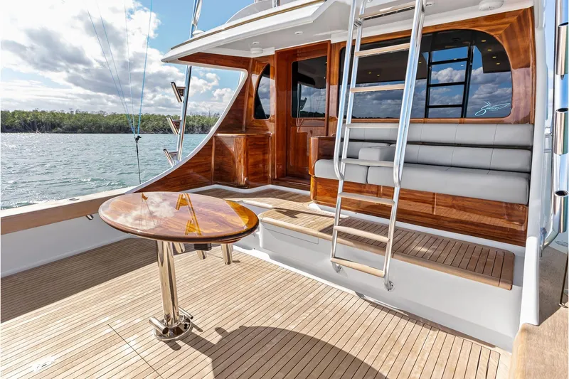 Slide: The Image of Luxurious 2017 Spencer Convertible yacht deck with wooden table and seating. - 20