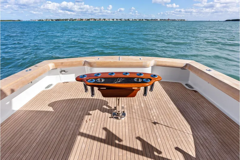 Slide: The Image of 2017 Spencer Convertible yacht deck with ocean view and fishing rod holders. - 24
