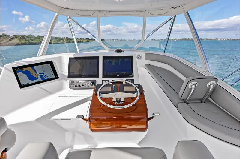 Slide: The Image of 2017 Spencer Convertible yacht helm with navigation screens and luxurious seating. - 29