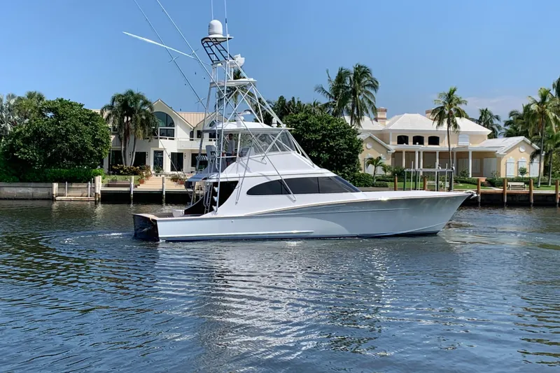 Slide: The Image of 2017 Spencer Convertible yacht cruising on blue ocean near coastline under clear sky. - 3